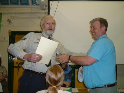 Phill Bristow (Troop Helper) Receiving his Service Certificate from Ray Tucker